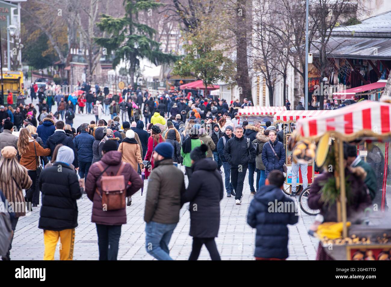 ISTANBUL - DEC 31: Crowd of people walking in winter day at the old town of Istanbul. Sultanahmet square with tourists, December 31. 2020 in Turkey Stock Photo