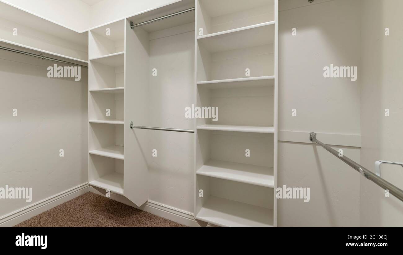 Pano Interior of an empty walk-in closet room with floor vent Stock Photo