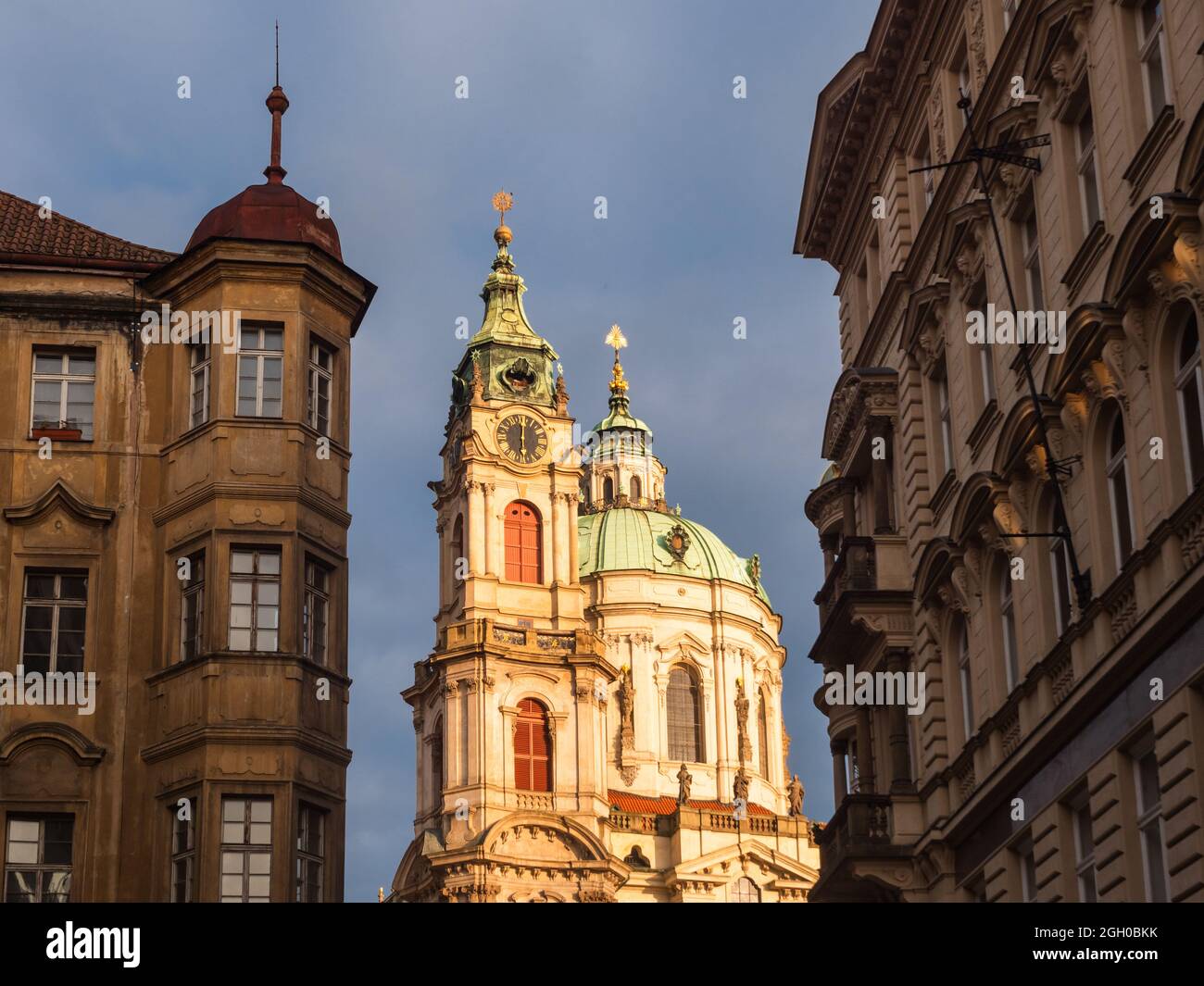 Baroque Dome and Spire of Saint Nicholas Church in the Lesser Town of Prague, Czech Republic in the Morning Stock Photo