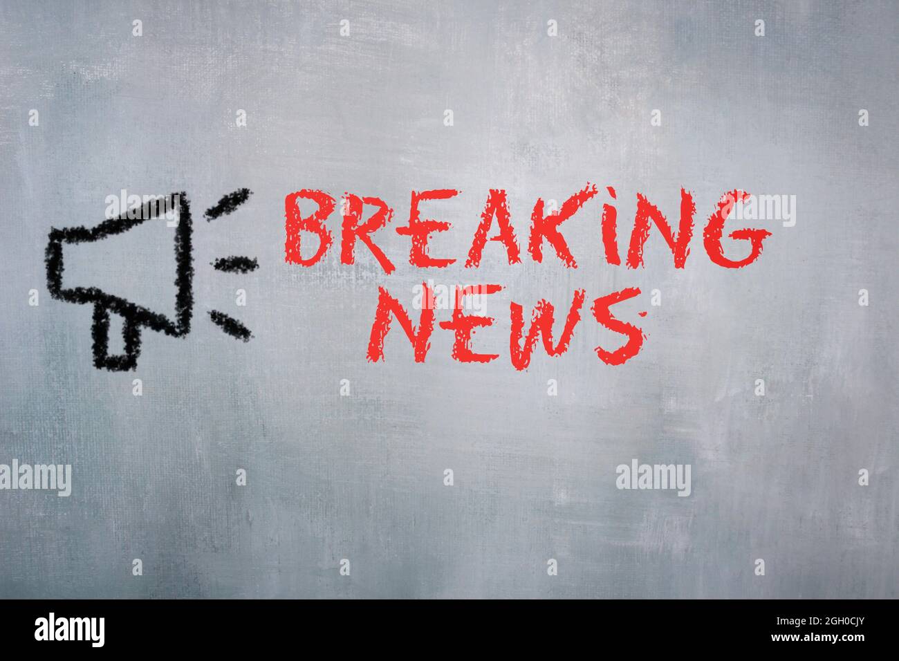 Chalkboard drawing image of megaphone and text BREAKING NEWS Stock Photo
