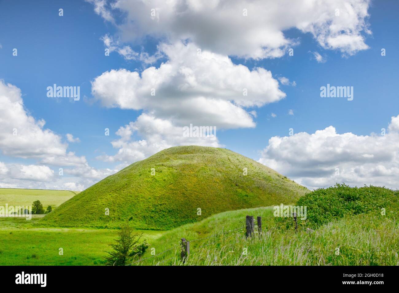 Silbury Hill, the prehistoric artificial chalk mound near Avebury in the England, Wiltshire, a UNESCO World Heritage Site. Stock Photo