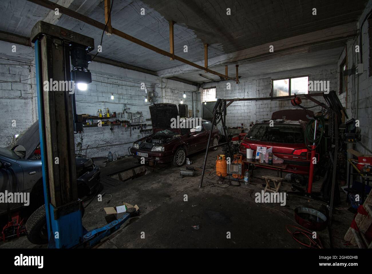 Inside the real car repair shop Stock Photo