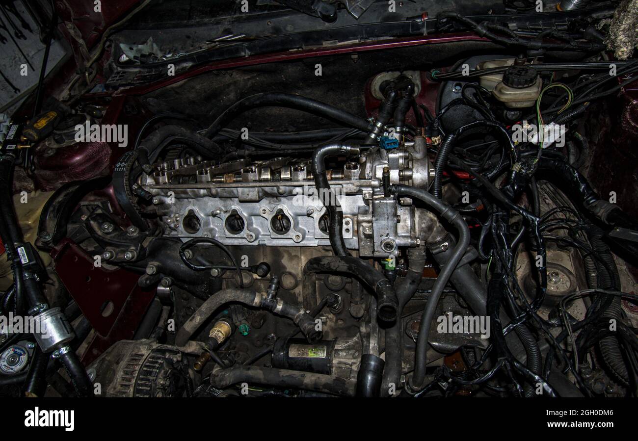 Open real car engines in the repair phase in a car mechanic shop Stock Photo Alamy