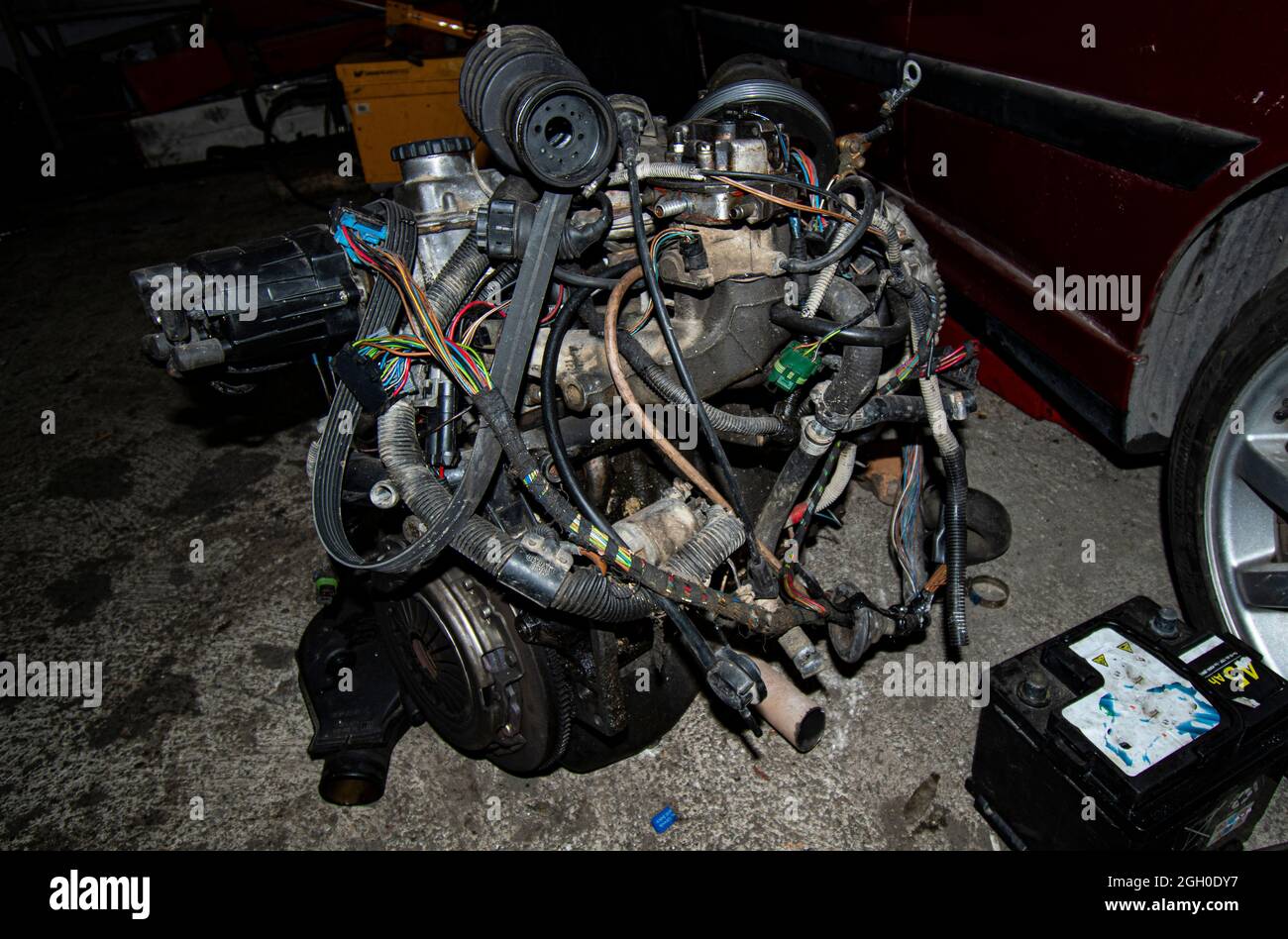 Open real car engines in the repair phase in a car mechanic shop Stock Photo Alamy
