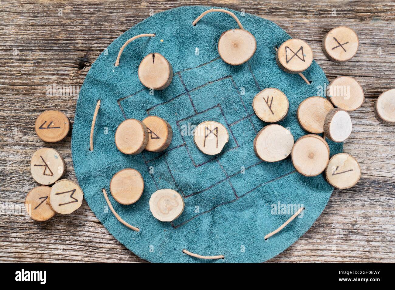 Handmade runes for fortunetelling Stock Photo - Alamy