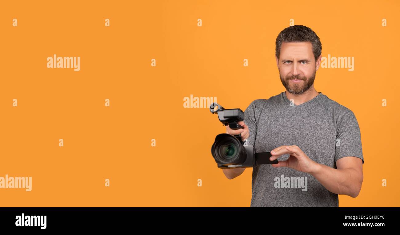 movie maker make vlog. professional filmmaker hold videocamera. cinematography. Stock Photo