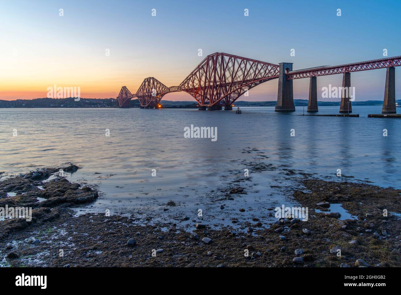View of the Forth Rail Bridge over the Firth of Forth at dusk, South Queensferry, Edinburgh, Lothian, Scotland, United Kingdom, Europe Stock Photo