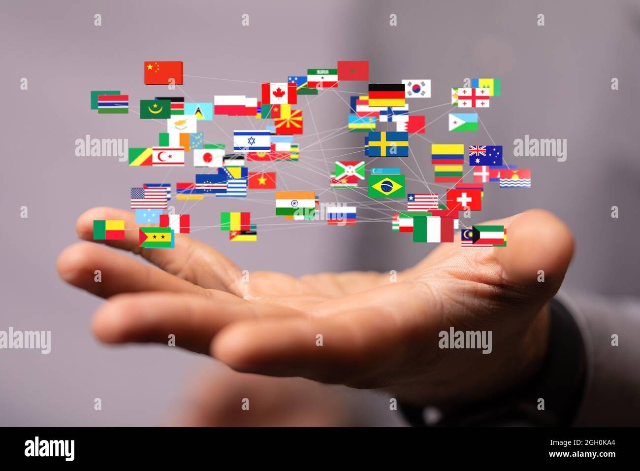 Digital concept of Global communication, floating national flags of the ...