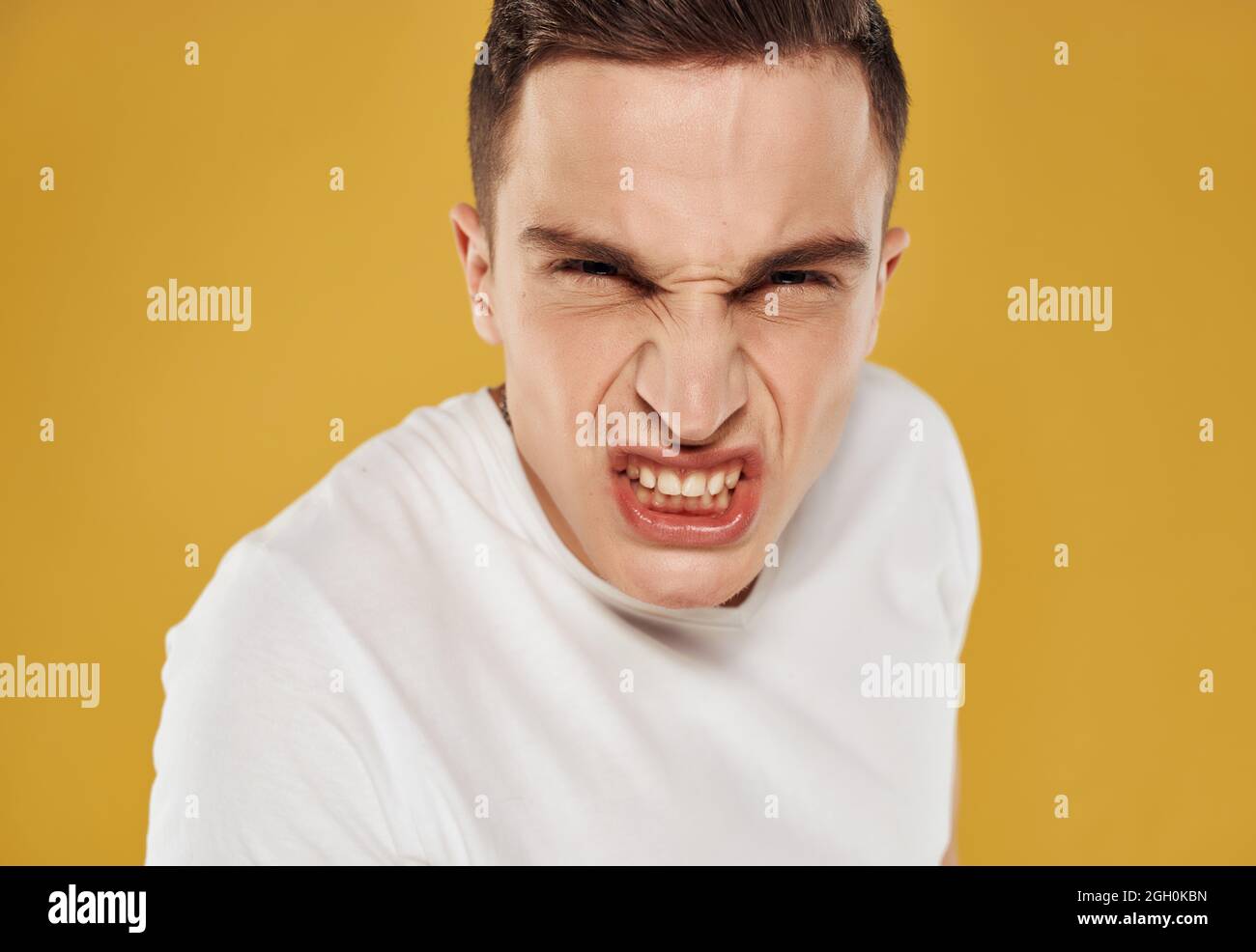angry man in white t-shirt emotion close-up isolated background Stock ...