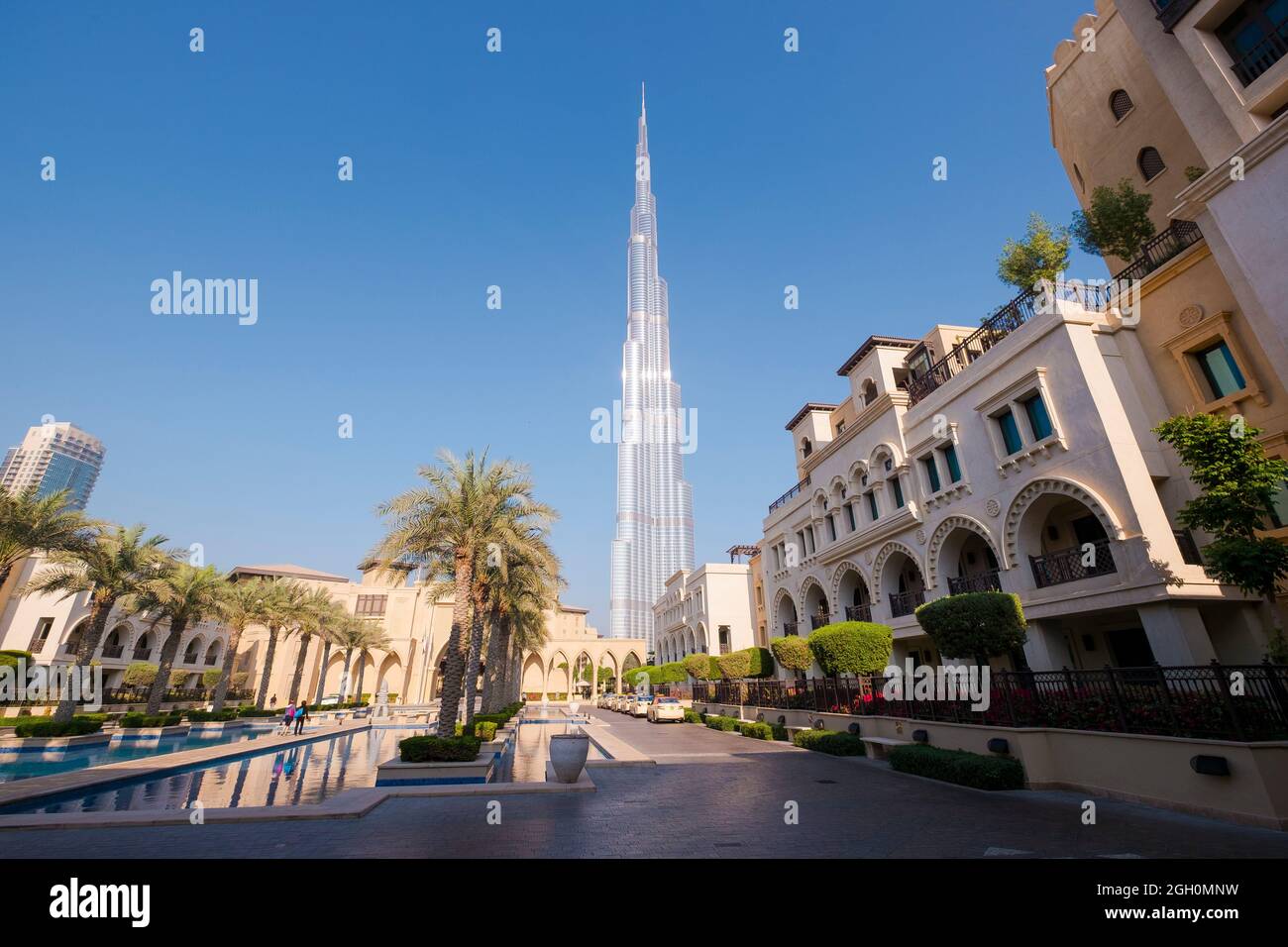 The skyscraper Burj Khalifa in the background of new mixed development. In Dubai, United Arab Emirates. Stock Photo