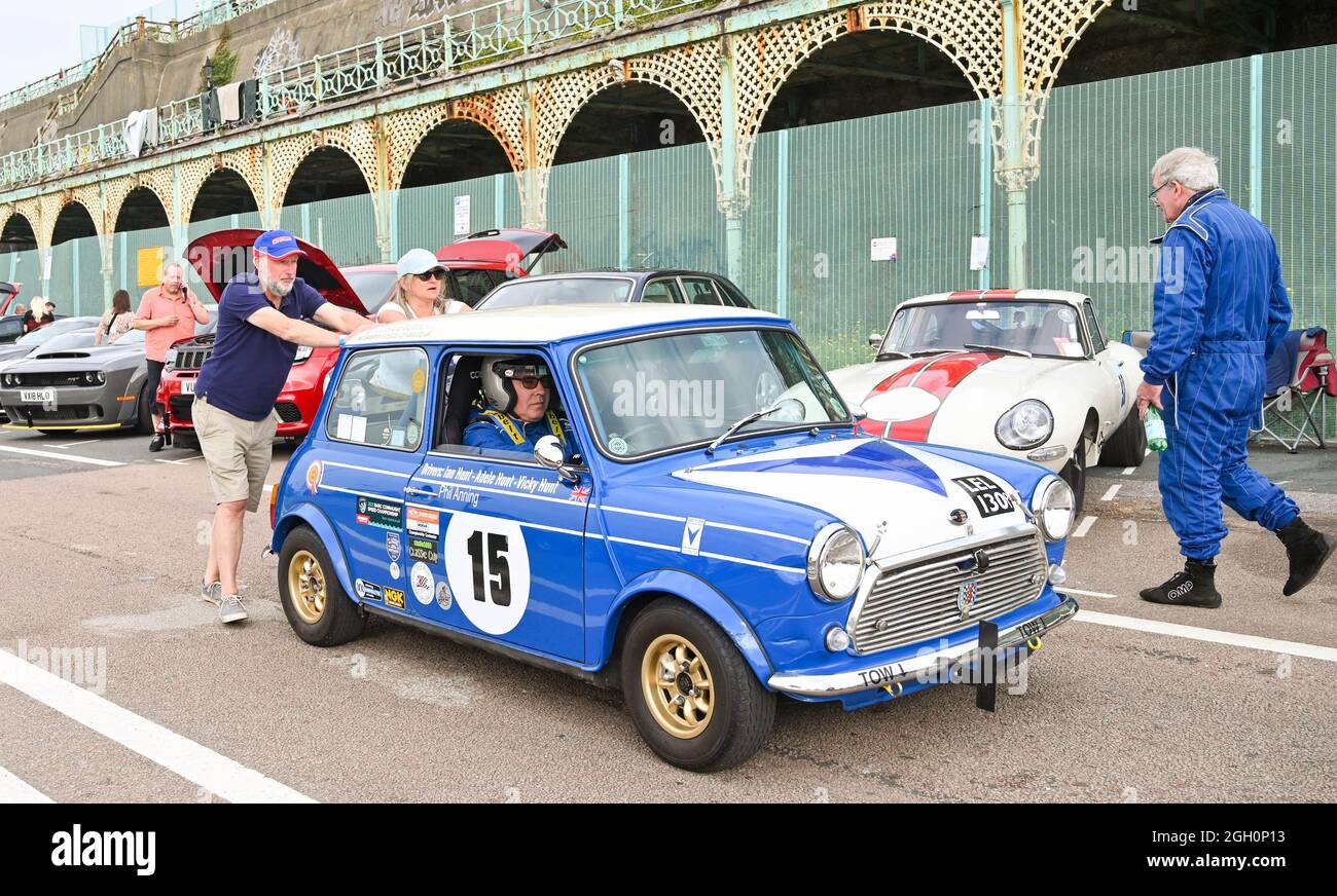 Brighton, UK. 4th September 2021 - This Mini gets a push to the start line at the Brighton National Speed Trials today which has returned this year after being cancelled in 2021 because of COVID-19. Cars of all vintages take part in the timed sprint along Madeira Drive  .  : Credit Simon Dack / Alamy Live News Stock Photo