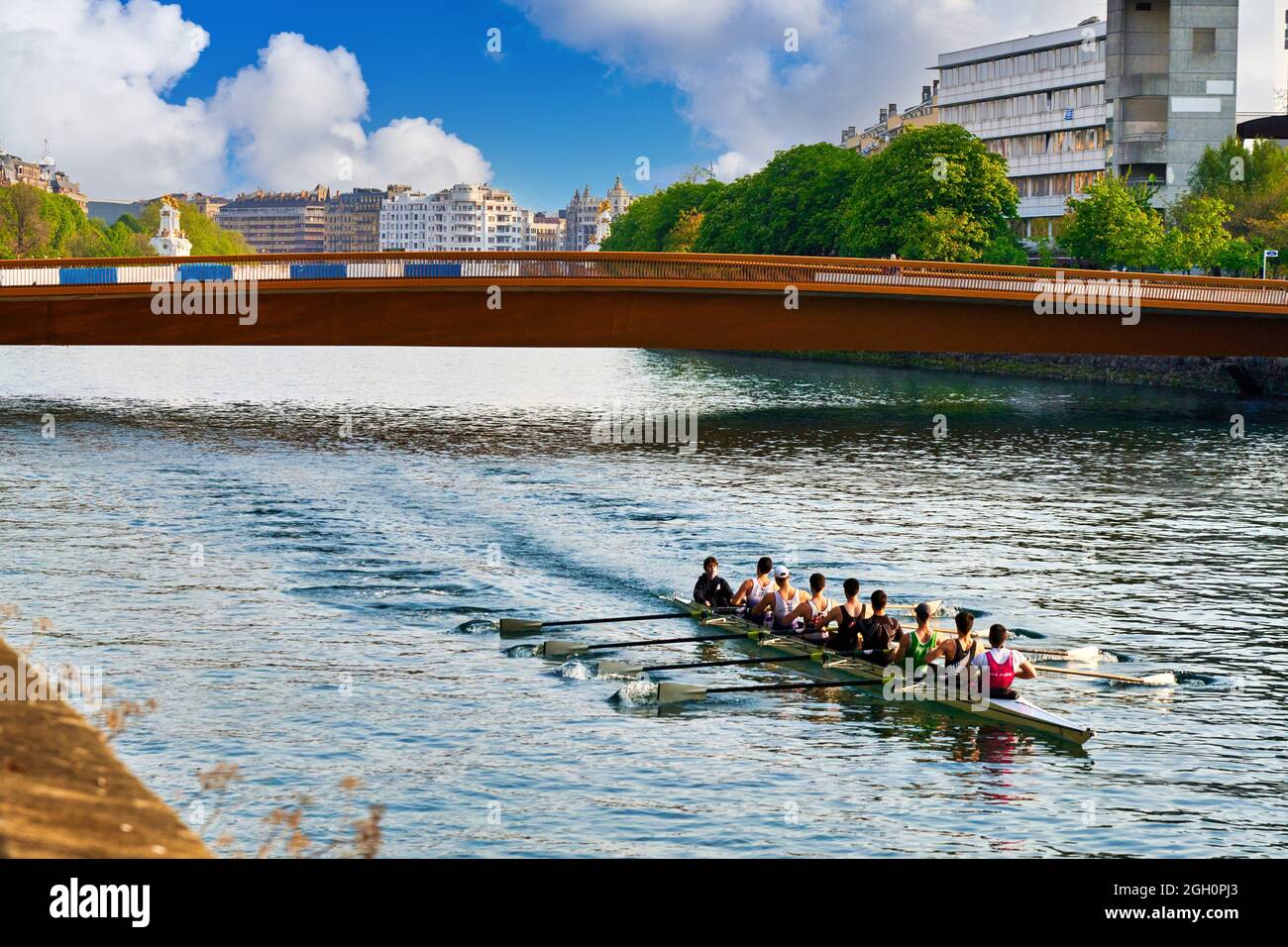 Rowers, Urumea River, Mundaiz bridge, Donostia, San Sebastian, Basque Country, Spain, Europe. Rowing is an exercise in which the whole body is Stock Photo