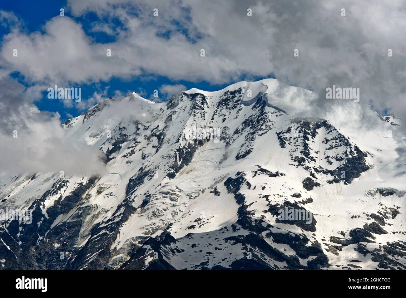 Snow-covered peaks in the Swiss Alps, Saas-Fee, Valais, Switzerland. Stock Photo