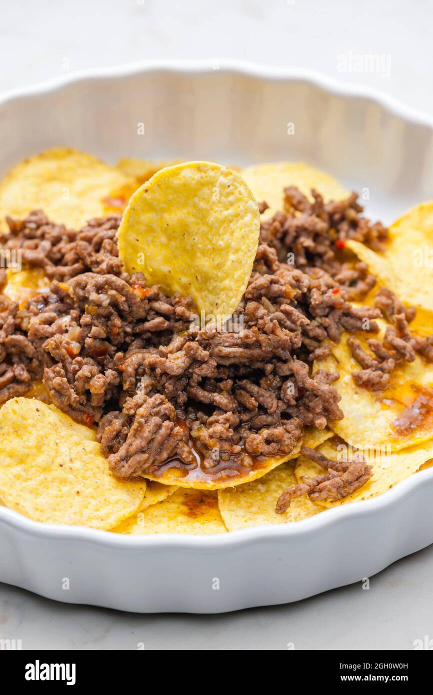minced beef baked with nachos Stock Photo Alamy