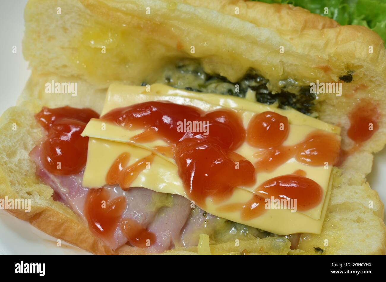 baked Danish bread stuffed slice pork bacon with mashed spinach and