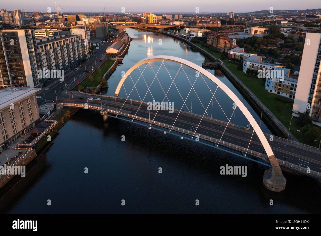 Glasgow, Scotland, 1 September 2021. PICTURED: The Clyde Arc (known locally as the Squinty Bridge). Drone aerial view looking down from above of the COP26 venue which takes place at Glasgow’s SEC (Scottish Event Campus) which was formerly known as the SECC (Scottish Exhibition and Conference Centre) along with the SEC Armadillo and SSE Hydro Arena which forms the new campus. The Climate Change conference COP26 will be hosted here from 1st to 12th November this year.  Credit: Colin Fisher. Stock Photo
