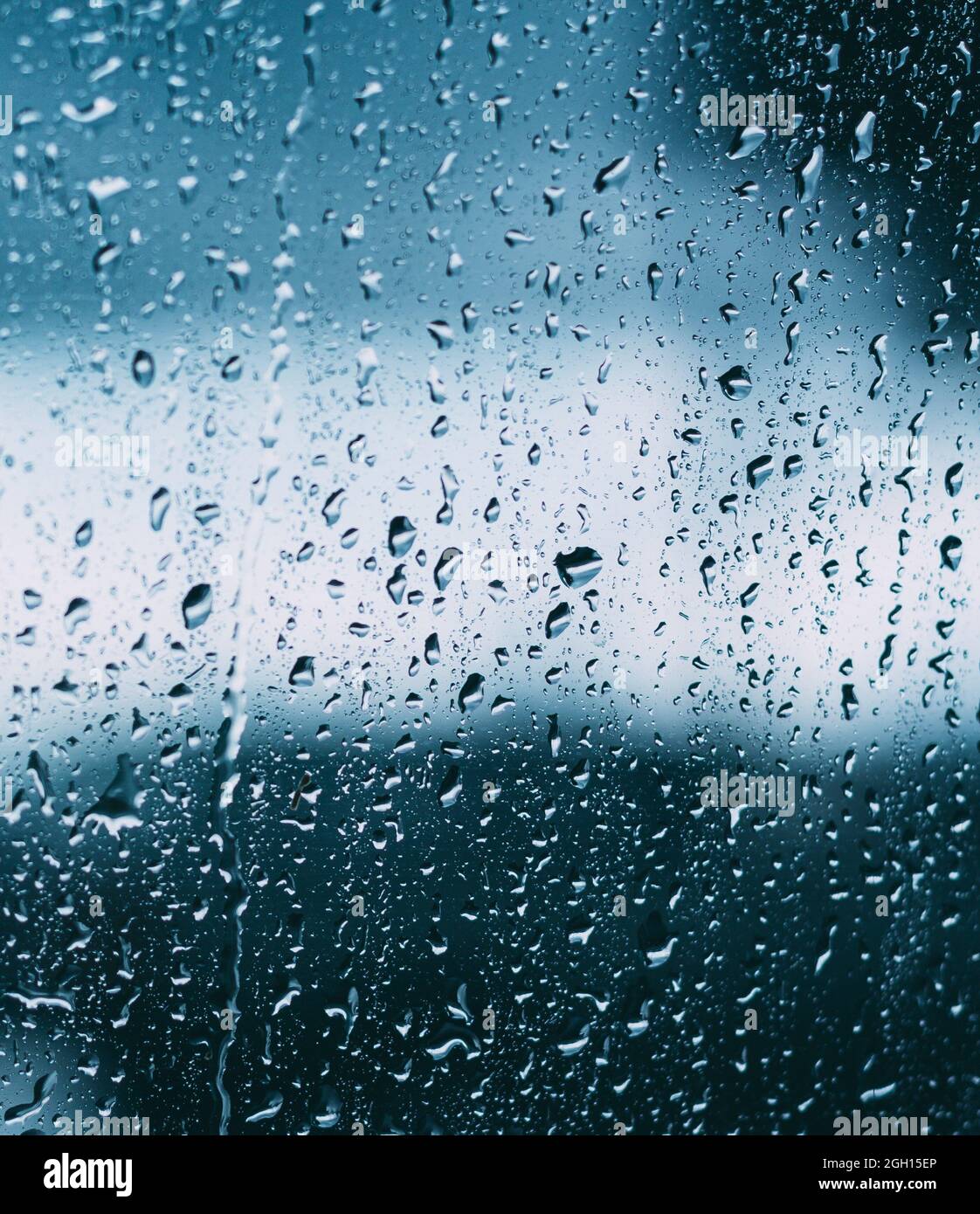 Drops Of Water Or Rain On Wet Glass Background. Moody Photo In Cold Blue Color Stock Photo Alamy