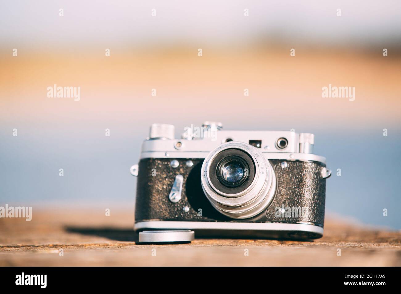 35mm Vintage Old Retro SmallFormat Rangefinder Camera On Old Wooden