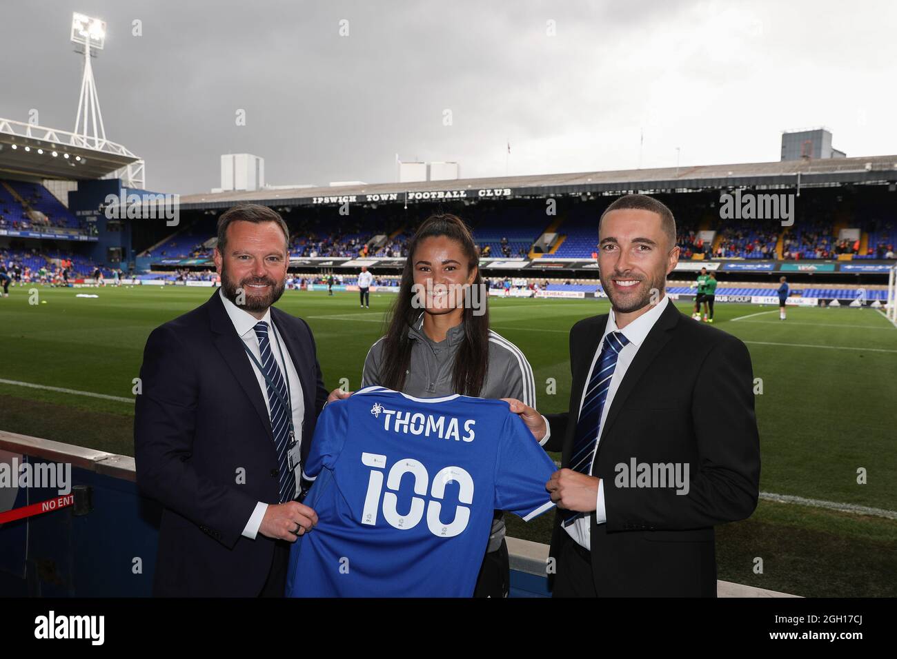 Natasha Thomas of Ipswich Town Women is presented with a shirt from CEO of Ipswich Town, Mark Ashton (L) and Ipswich Town Women Manager, Joe Sheehan (R) pre match on achieving 100 goals for the club - Ipswich Town v AFC Wimbledon, Sky Bet League One, Portman Road, Ipswich, UK - 28th August 2021  Editorial Use Only - DataCo restrictions apply Stock Photo