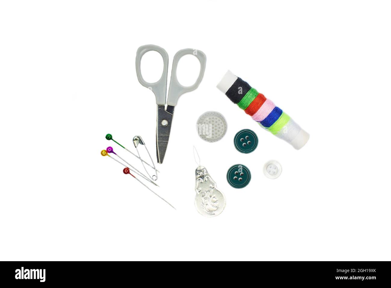 Sewing Needle thread scissors thimble tailor buttons. Closeup top view ...