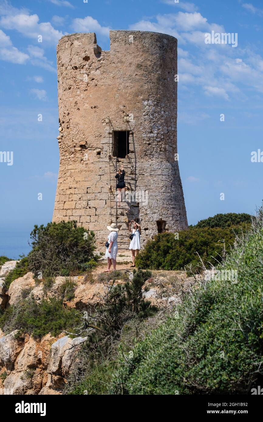 tourists visiting Cap Blanc tower built in 1579, llucmajor, Mallorca,  Balearic Islands, Spain Stock Photo - Alamy