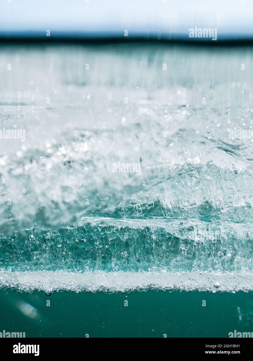 Layer of melting ice on surface of lake in springtime Stock Photo - Alamy