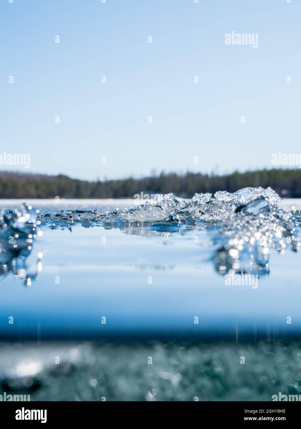 Melting ice crystals on surface of clear-watered lake Stock Photo - Alamy