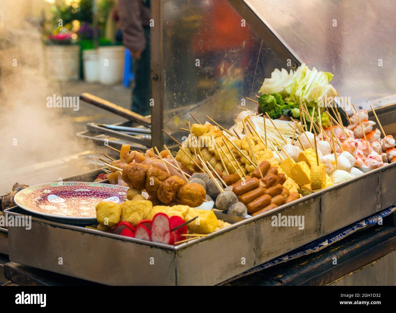 Macau, China. Snacks on sale at a street stall. Stock Photo