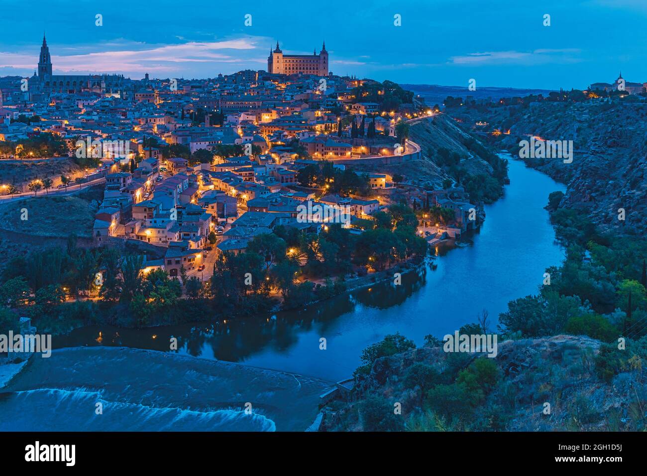 Toledo, Toledo Province, Castilla-La Mancha Spain. Overall view of the historic centre showing the Tagus River (Rio Tajo) and the Alcazar. The Stock Photo