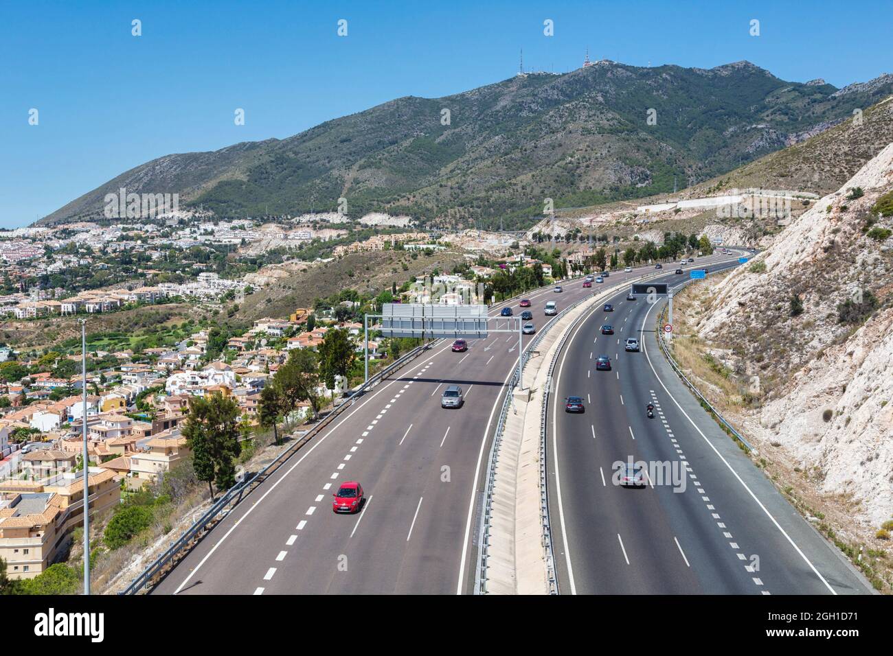Aerial view of A-7, E-15 motorway. Costa del Sol, Malaga Province, Spain. The town to the left is Arroyo de la Miel. Stock Photo
