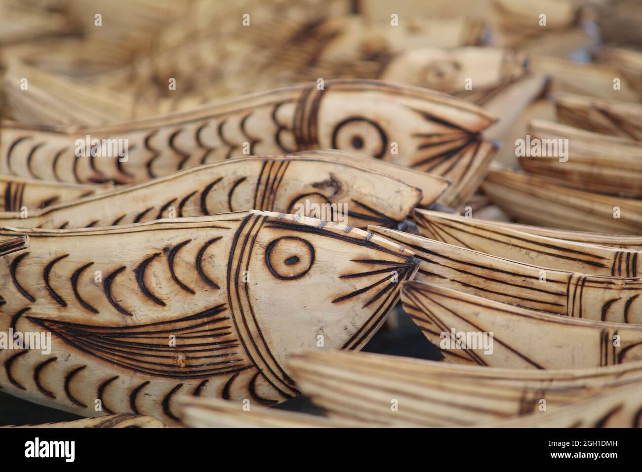 Beautiful closeup of wooden handcraft fish structures being sold at the ...