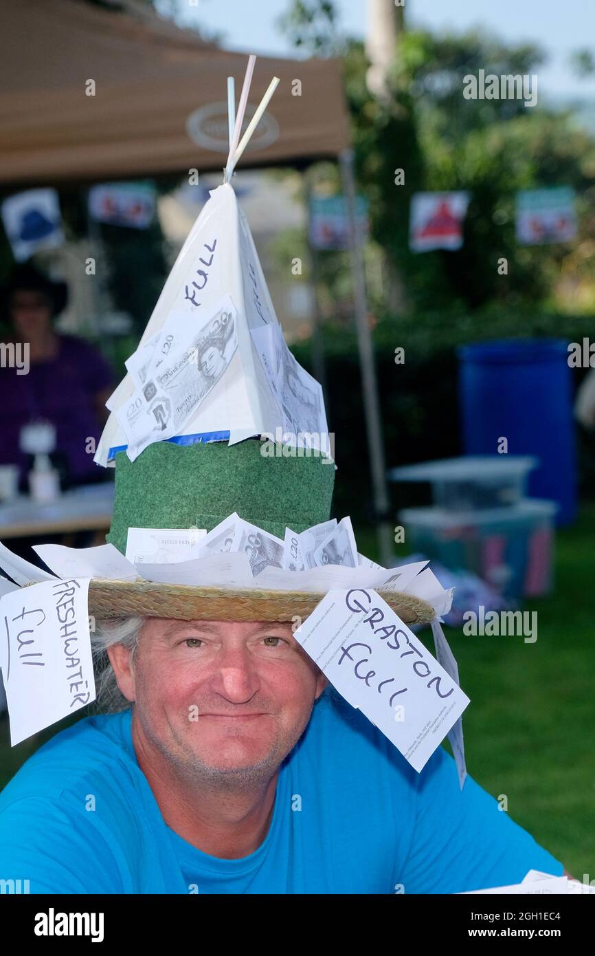 Bridport Hat Festival Bridport Dorset UK. 4th Sep 2021. Hat wearers gathered in Bridport as the Hat Festival returns to the town in the shape of a garden party. Hat wearers showed
