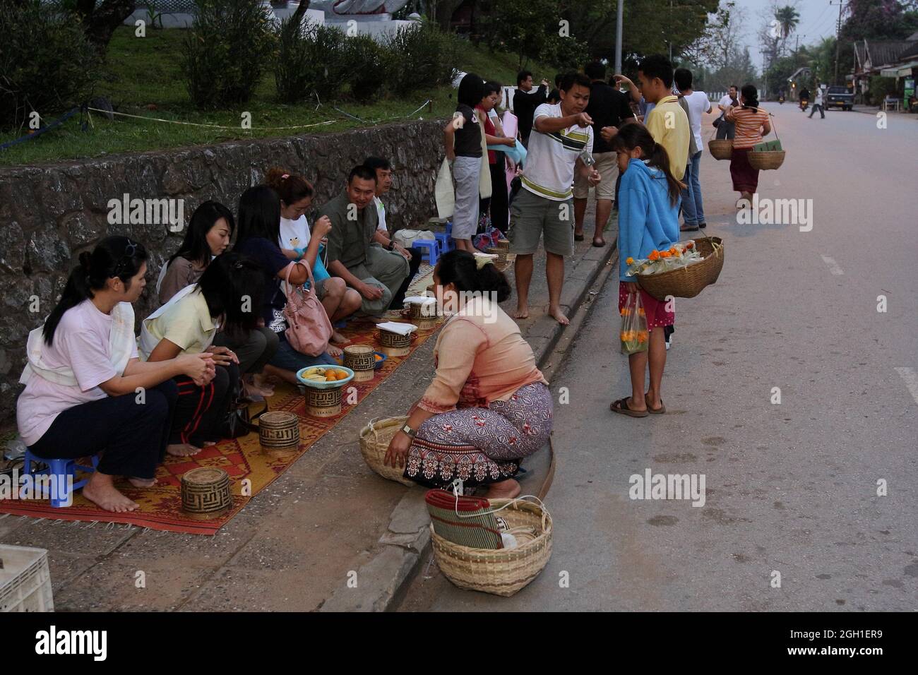 Lao People preparing for the morning alms giving ceremony, Luang ...