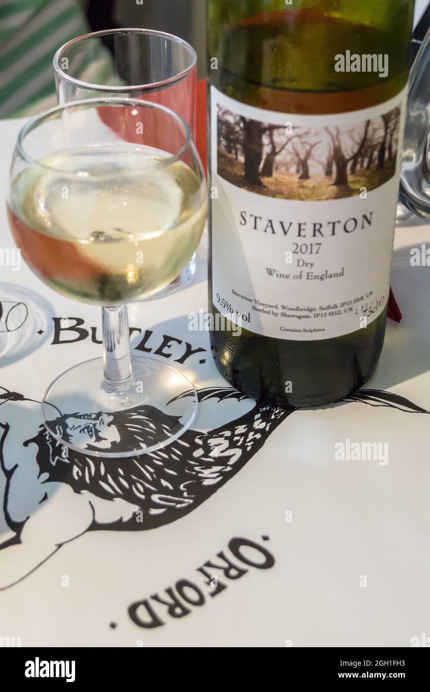 Glass and bottle of Staverton dry English wine,Orford Butley Oysterage restaurant, Orford, Suffolk, England Stock Photo