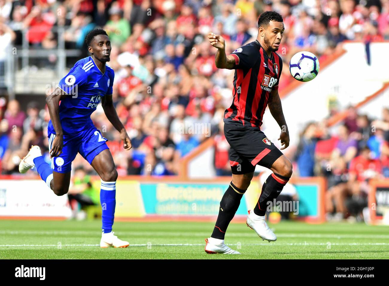 Joshua King, of AFC Bournemouth bursts past Wilfred Ndidi of Leicester City - AFC Bournemouth v Leicester City, Premier League, Vitality Stadium, Bournemouth - 15th September 2018 Stock Photo