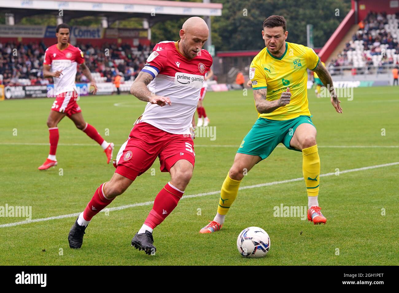 Stevenage’s Scott Cuthbert (left) and Swindon Town’s Ben Gladwin battle for the ball during the Sky Bet League Two match at the Lamex Stadium, Stevenage. Picture date: Saturday September 04, 2021. Stock Photo