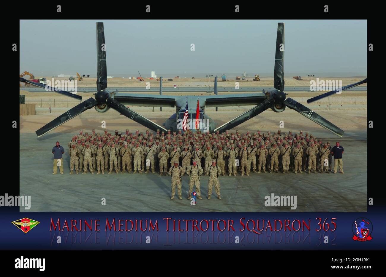 Marines from Marine Medium Tiltrotor Squadron 365, 3rd Marine Aircraft Wing (Forward), stand with an MV-22B Osprey on the flightline here during a group photo taken shortly after they took over the Osprey mission in Afghanistan in July. Stock Photo