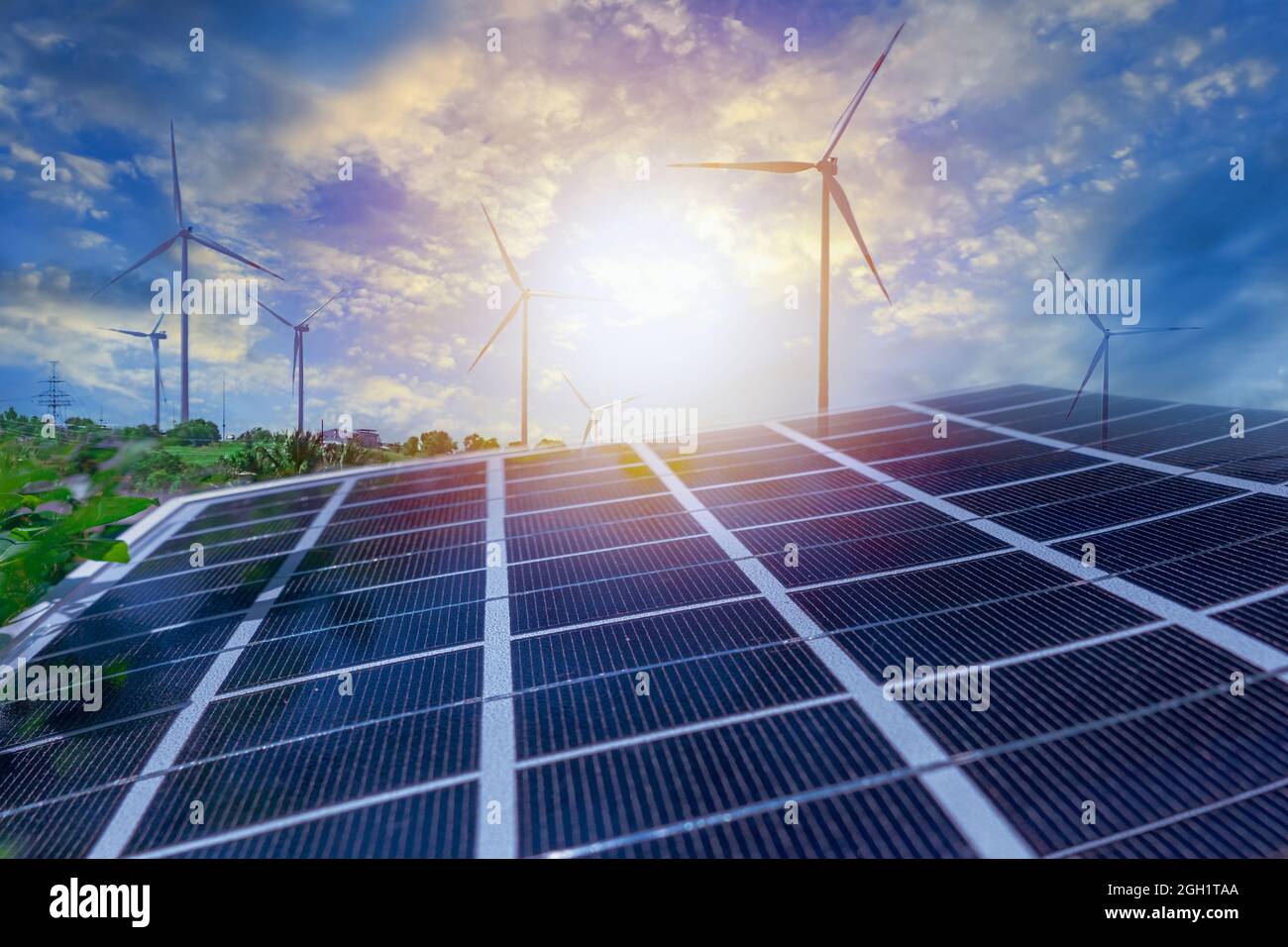 Solar panels and wind power stations. Renewable energy wind and solar generation. Defocused photo with soft focus. Stock Photo