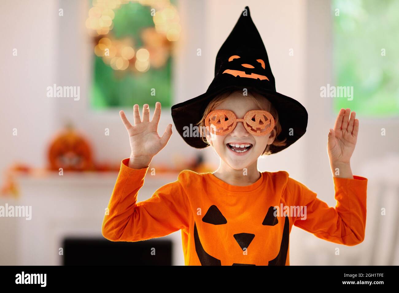 Kids trick or treat in Halloween costume. Children in colorful dress up ...