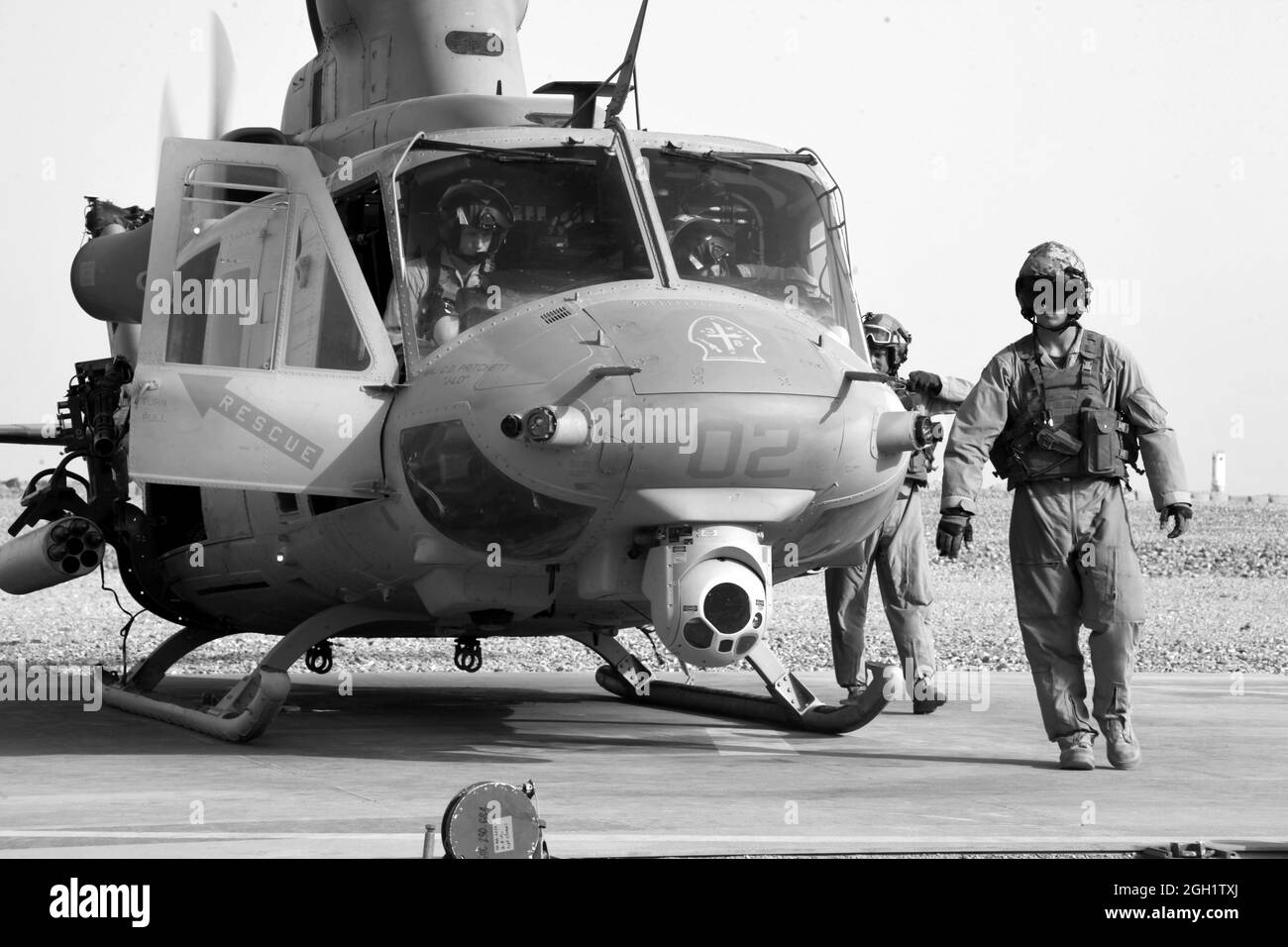 U.S. Marine Corps Lance Cpl. Seamos Clarke and Staff Sgt. Robert Wise of Marine Light Attack Helicopter Squadron (HMLA) 469 perform preflight checks on a UH-1Y Huey helicopter prior to returning to Camp Leatherneck after executing operation Halberd V in Helmand province, Afghanistan on June 20, 2012. HMLA-469 provided aerial reconnaissance and security for the Marines of 3rd LAR during operation Halberd V to prevent the distribution of contraband in support of counter insurgency operations. Stock Photo