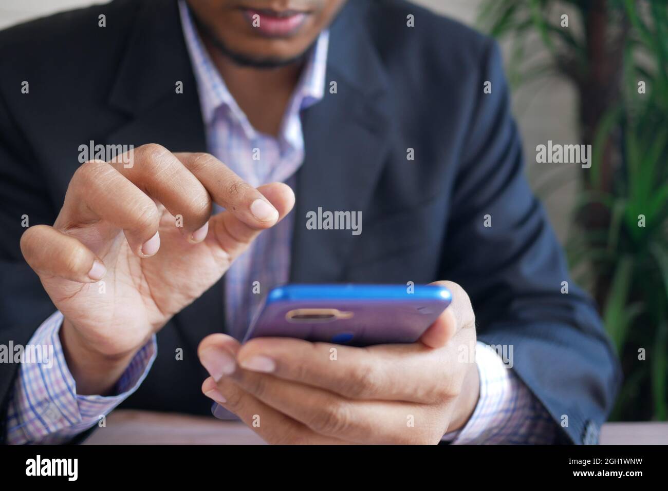 businessman hand using smart phone while sited  Stock Photo