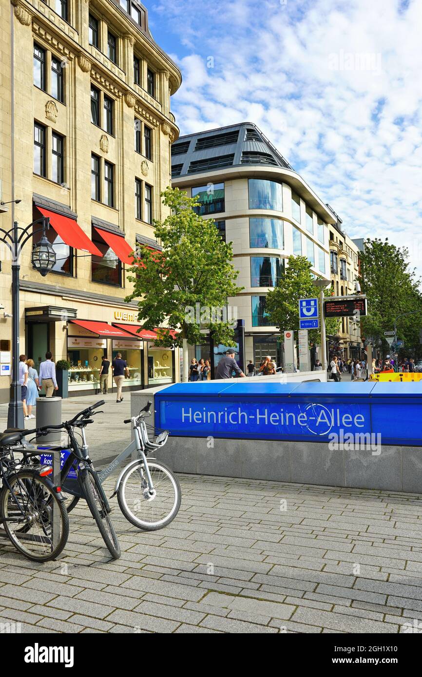 Underground station Heinrich-Heine-Allee at Corneliusplatz in downtown Düsseldorf, Germany, with parked bicycles in front. Stock Photo
