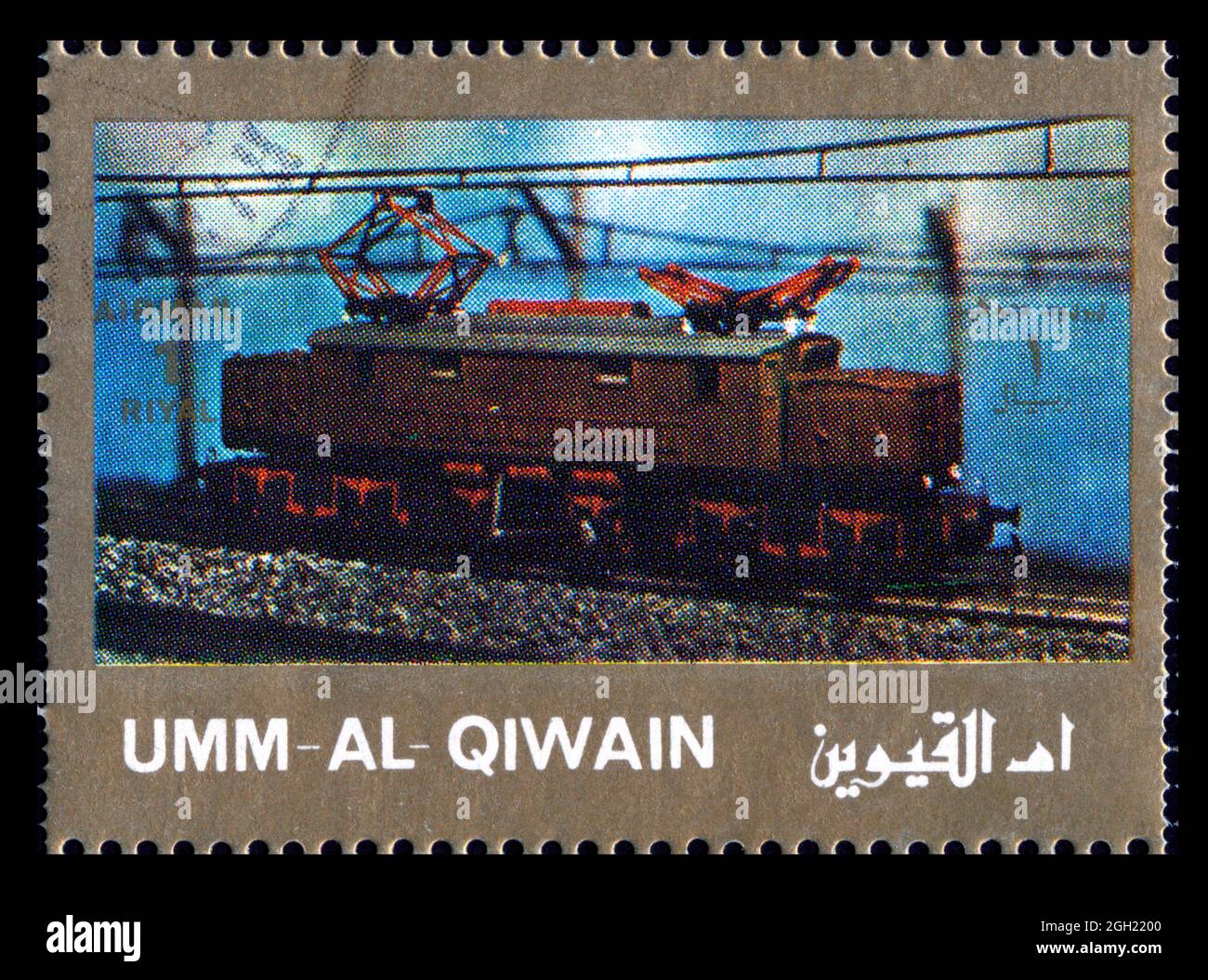 Stamp print in Umm Al Qiwain, locomotives Stock Photo - Alamy