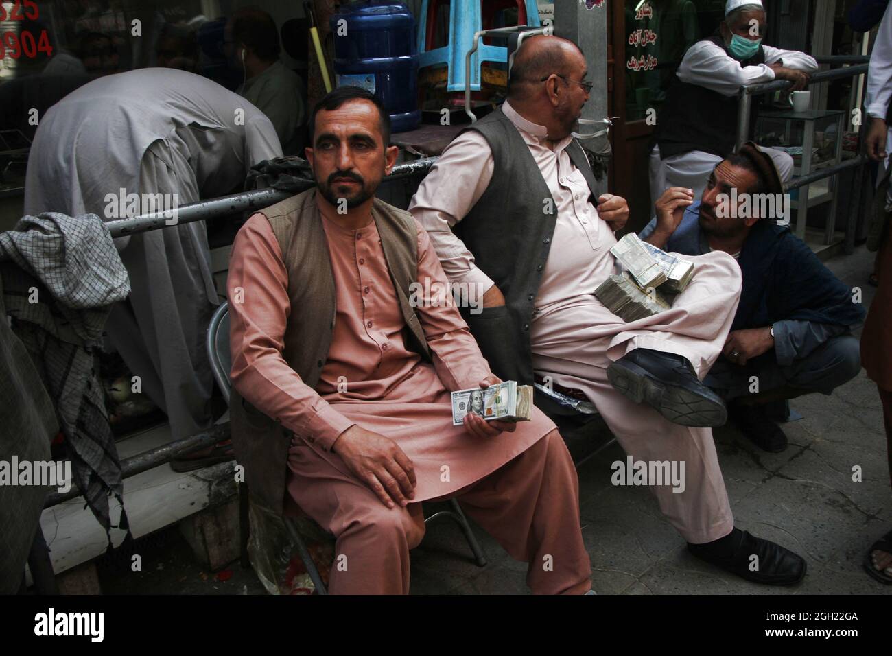 Kabul, Afghanistan. 4th Sep, 2021. Afghan currency exchange dealers wait for customers in Kabul, capital of Afghanistan, Sept. 4, 2021. The main money exchange market in Kabul, capital of Afghanistan reopened on Saturday, 10 days after Taliban takeover as a banking crisis still exists in the Asian country, a local source said. Credit: Saifurahman Safi/Xinhua/Alamy Live News Stock Photo