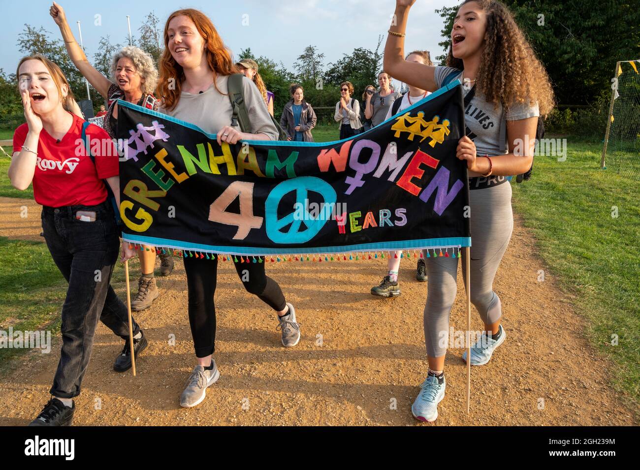 Women arrive at Greenham Common gates 40 years after the original march from Cardiff and the Greenham Womens Peace Camp on 5th September 1981. Stock Photo