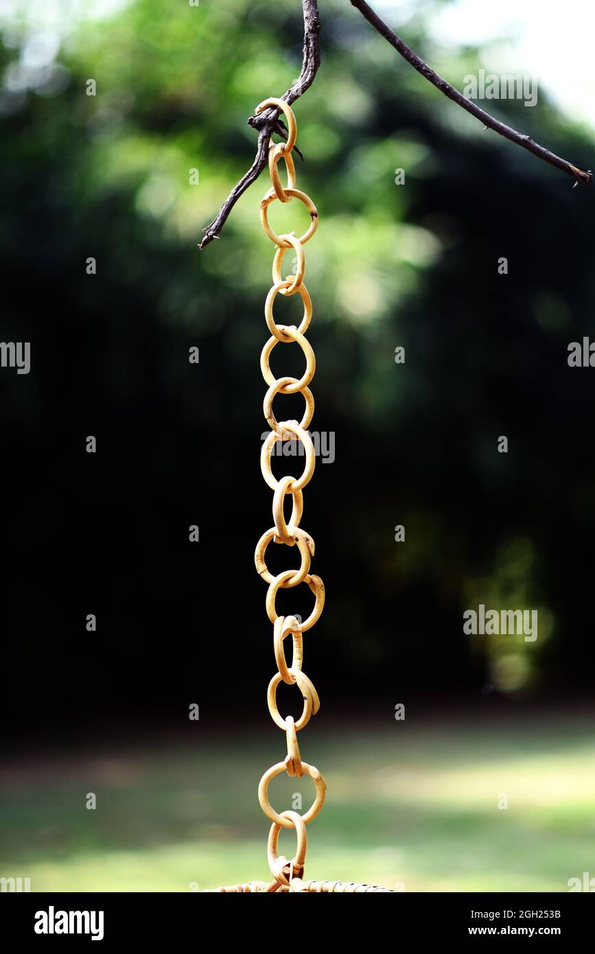 rattan hanging lamp chain with outdoor background selective soft focus