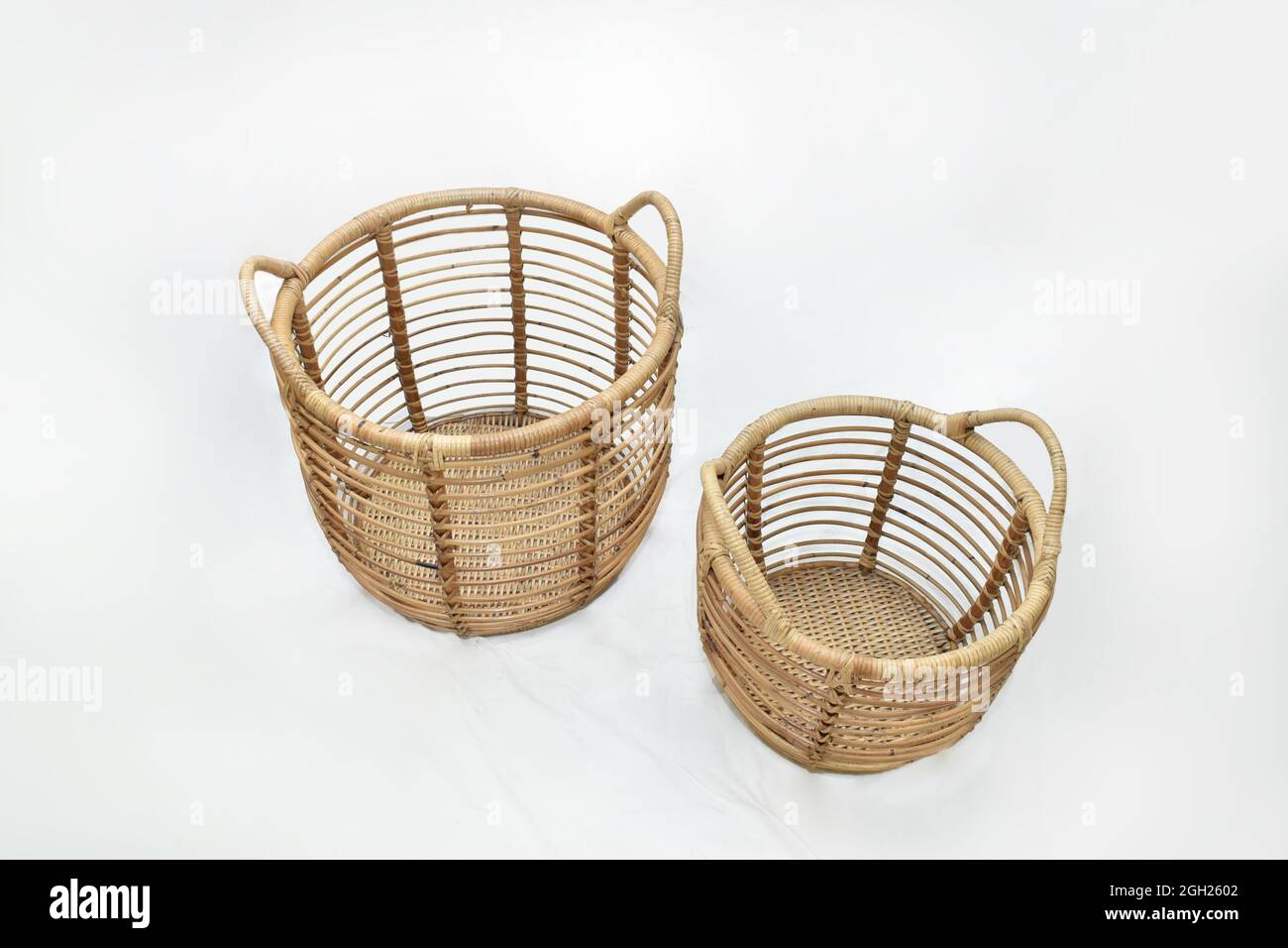 cane rattan Landry round basket set on white background selective soft