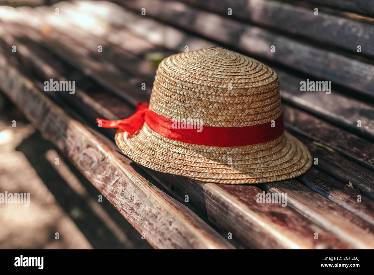 Straw hat on the wooden bench hi-res stock photography and images - Alamy