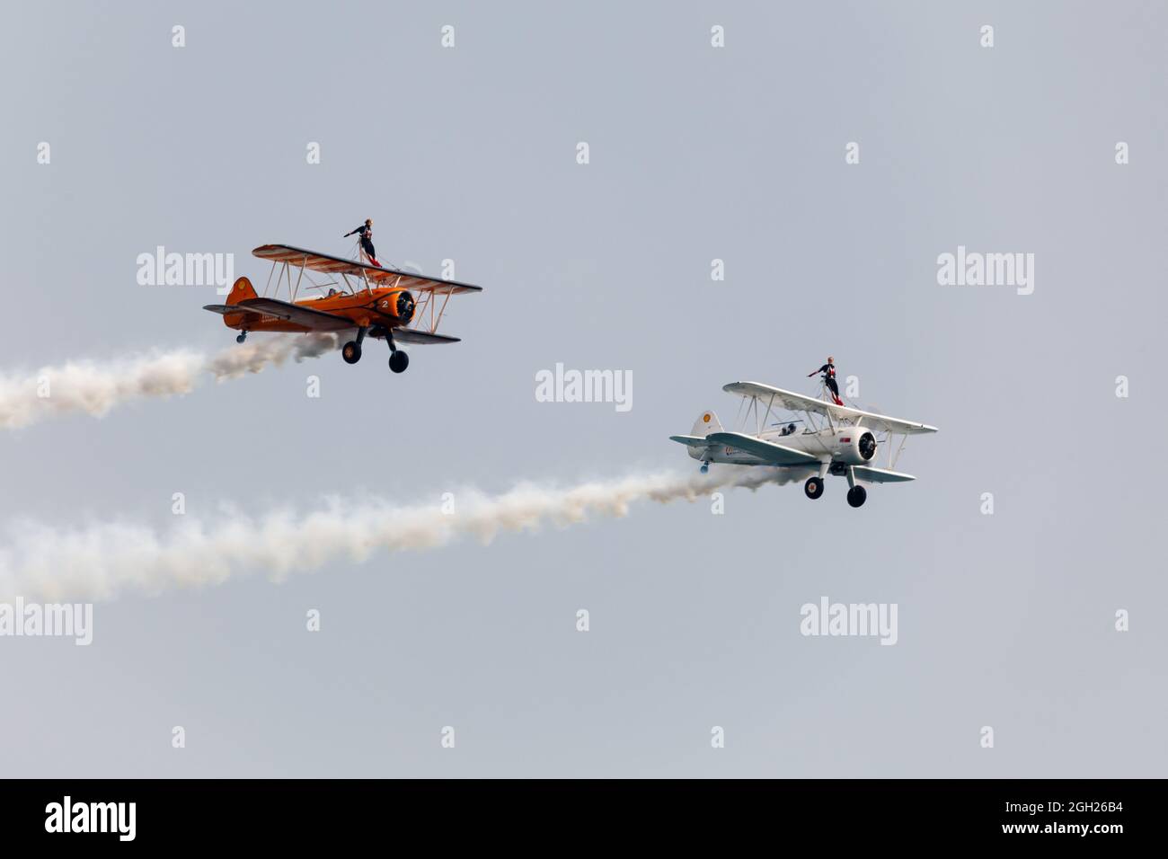 Bournemouth, UK. 4th Sep 2021. Wingwalkers perform at Bournemouth Air Festival shortly before cutting short their routine due to technical difficulties.  The white biplane was later reported to have crashed into the sea. Credit: Ed Brown/Alamy Live News Stock Photo