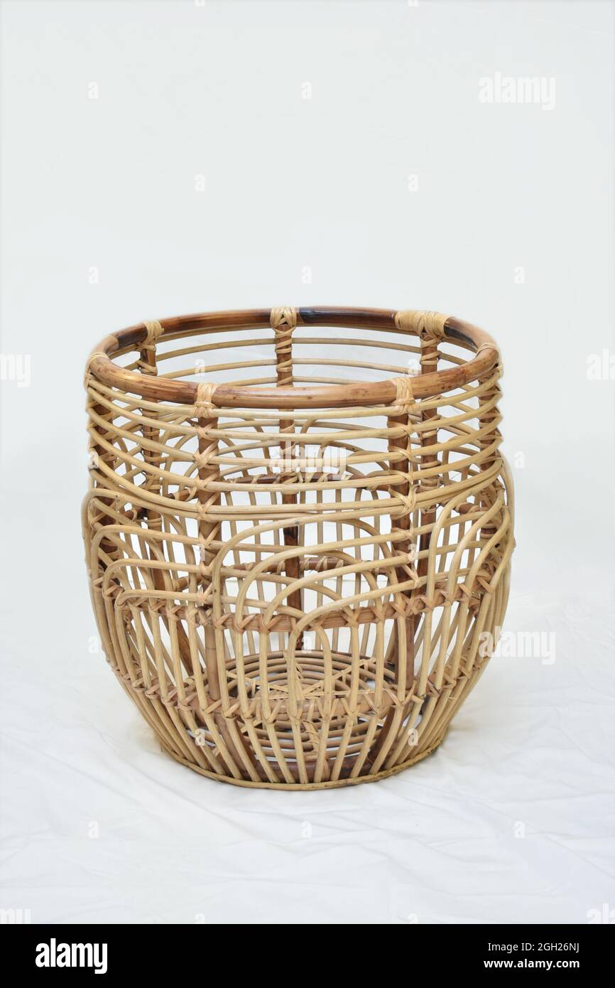 cane round basket on white background selective soft focus Stock Photo